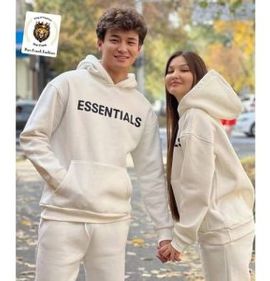 Portrait photo of essentials tracksuit